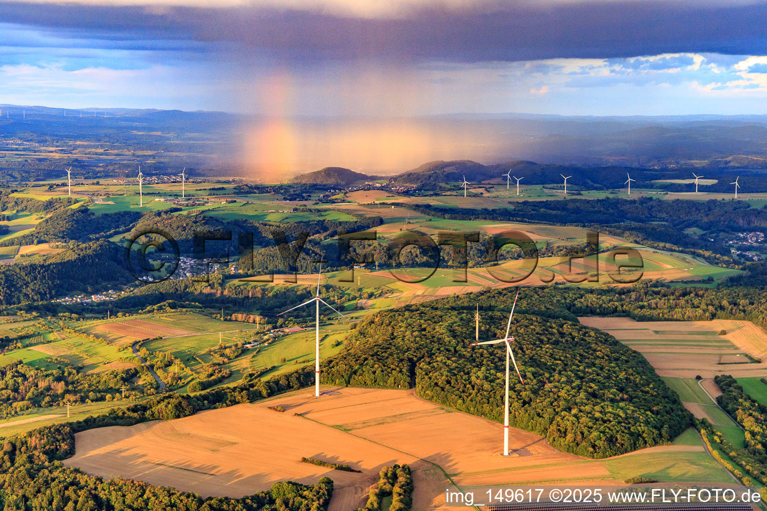 Aerial view of Wind farm Merchingen in front of a rain wall with rainbow in the district Merchingen in Merzig in the state Saarland, Germany