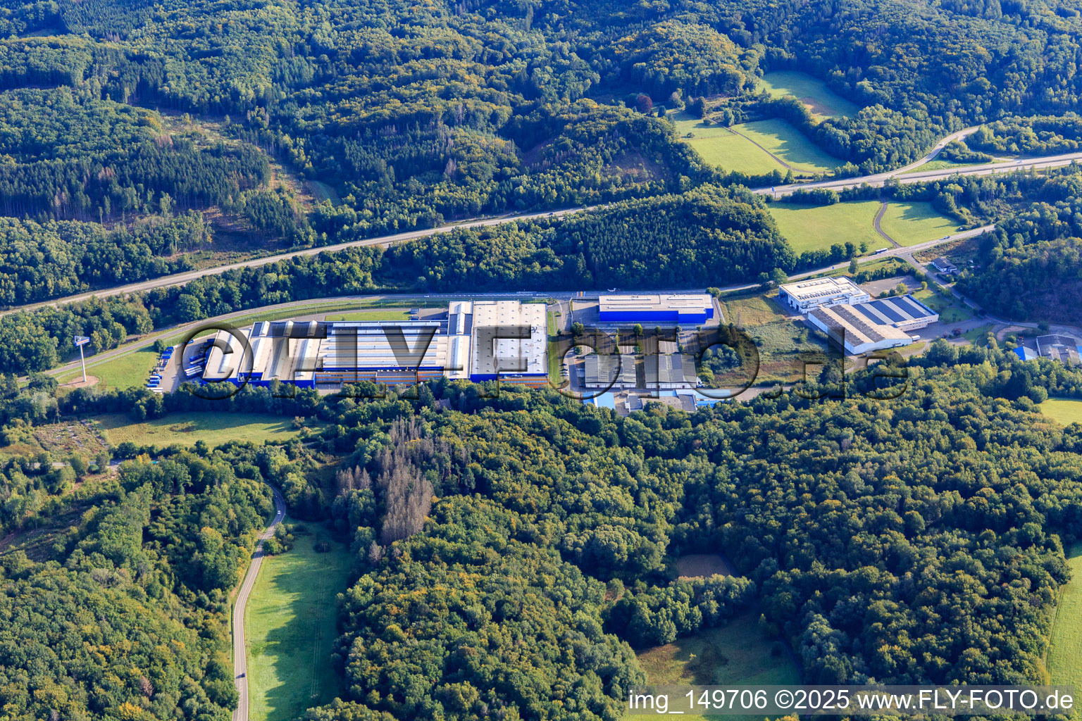 Industrial area In d. Bruchwiese with Hörmann KG Eckelhausen, WELLGO device technology/tool manufacturing and injection molding parts GmbH and Wittig GmbH construction company in the district Eckelhausen in Nohfelden in the state Saarland, Germany