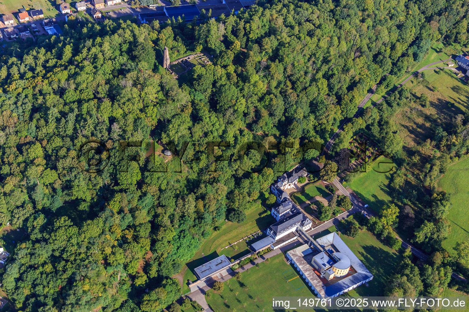 Aerial view of Castle Dagstuhl with Leibniz Center for Informatics. Castle garden and chapel below the ruins and foundations of castle Dagstuhl in the forest in the district Dagstuhl in Wadern in the state Saarland, Germany