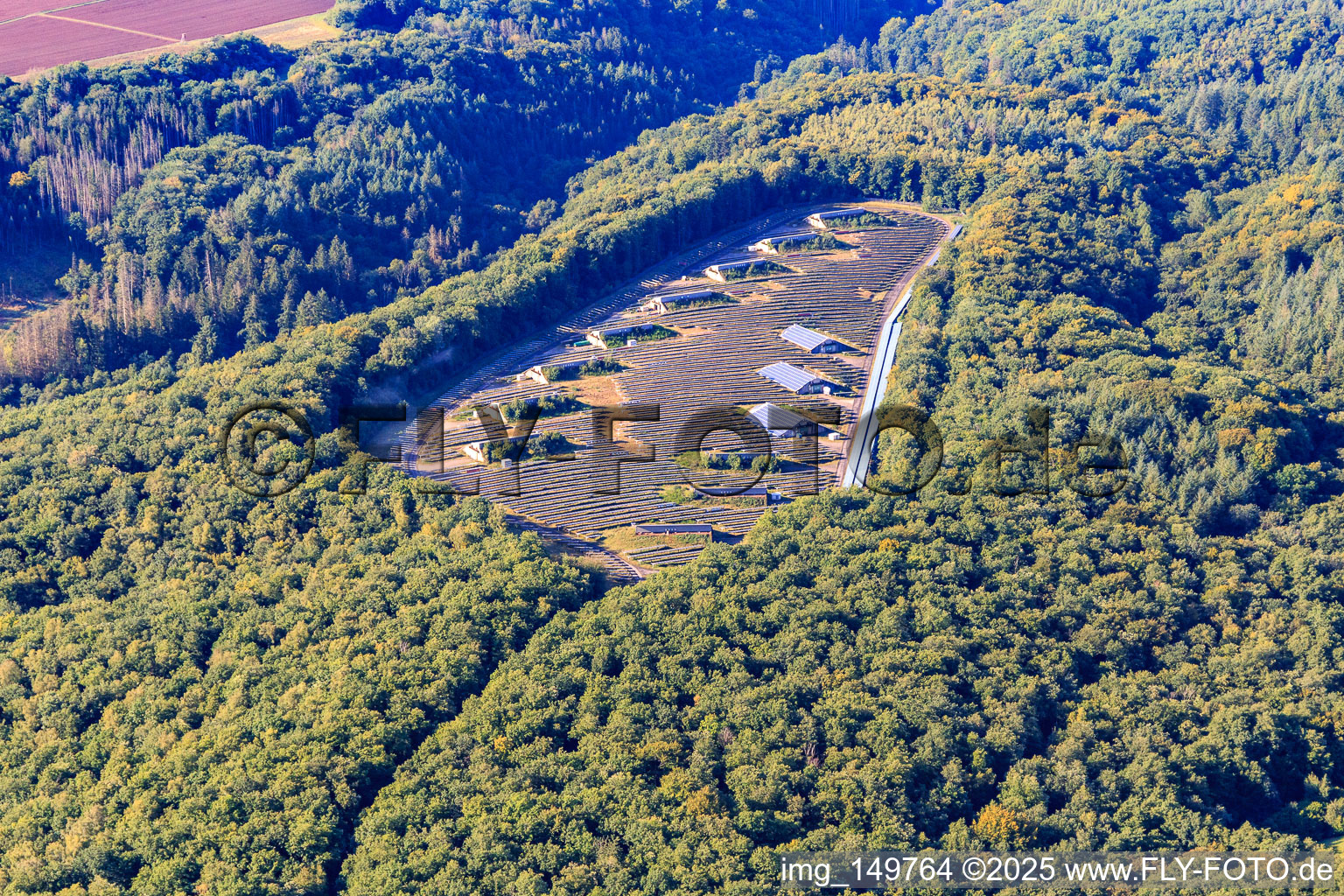 Open-air PV system in a forest clearing in the district Büschfeld in Wadern in the state Saarland, Germany