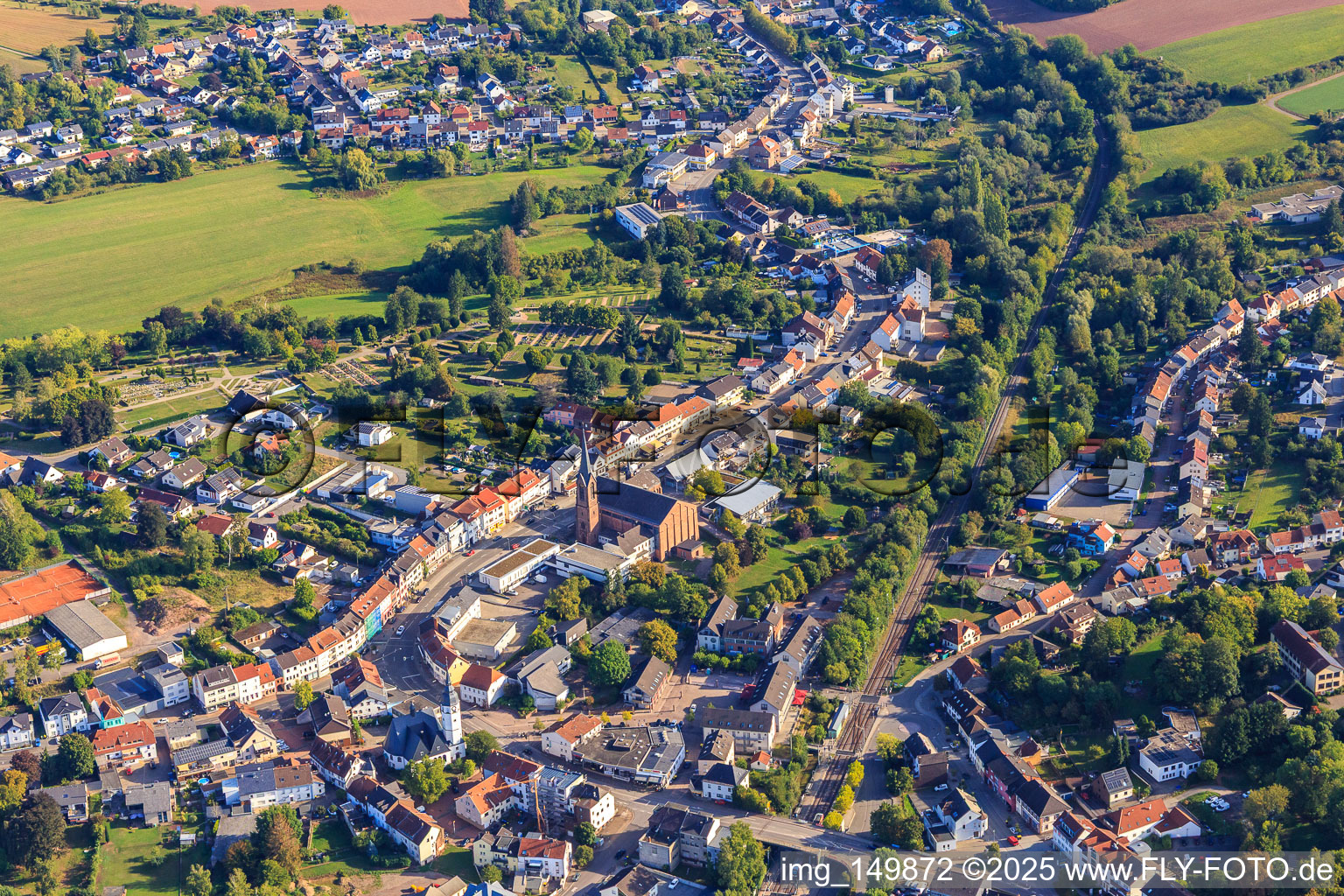 Trierer Straße with Catholic Church of the Visitation of Mary in Heusweiler in the state Saarland, Germany