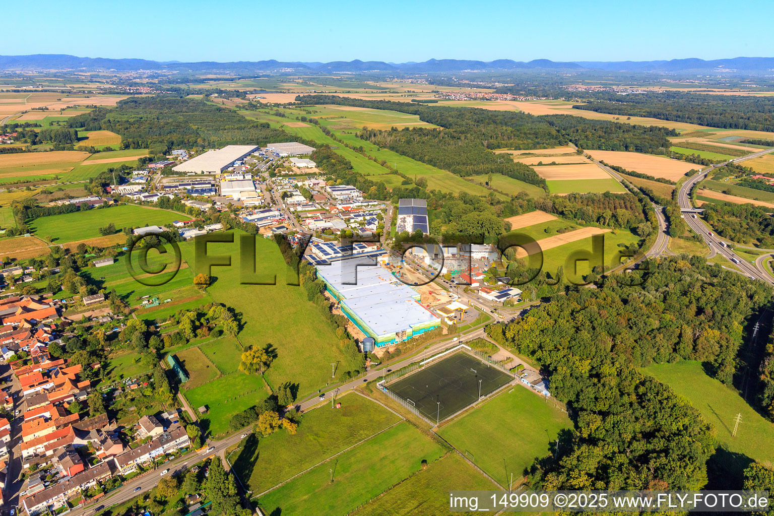 Aerial view of Construction site of the new logistics park of HANSAINVEST and DFI-Real-Estate Kandel after demolition of the OBI market in the district Minderslachen in Kandel in the state Rhineland-Palatinate, Germany
