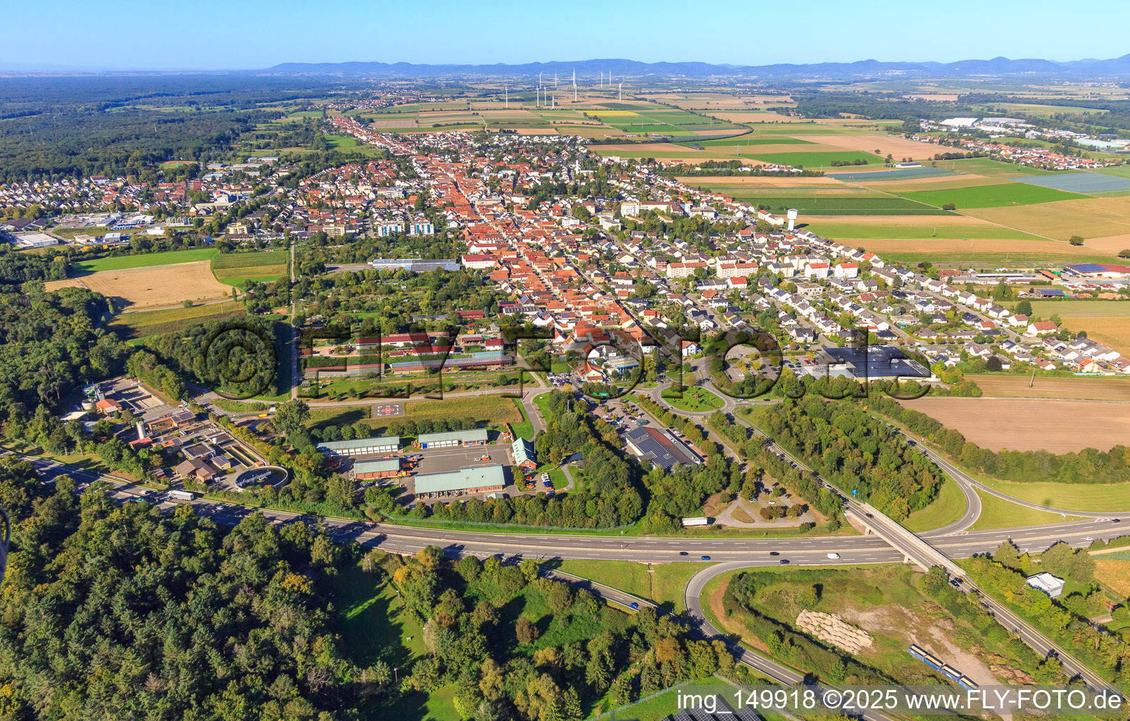 City view with motorway exit Kandel South of the A65 from the east in Kandel in the state Rhineland-Palatinate, Germany