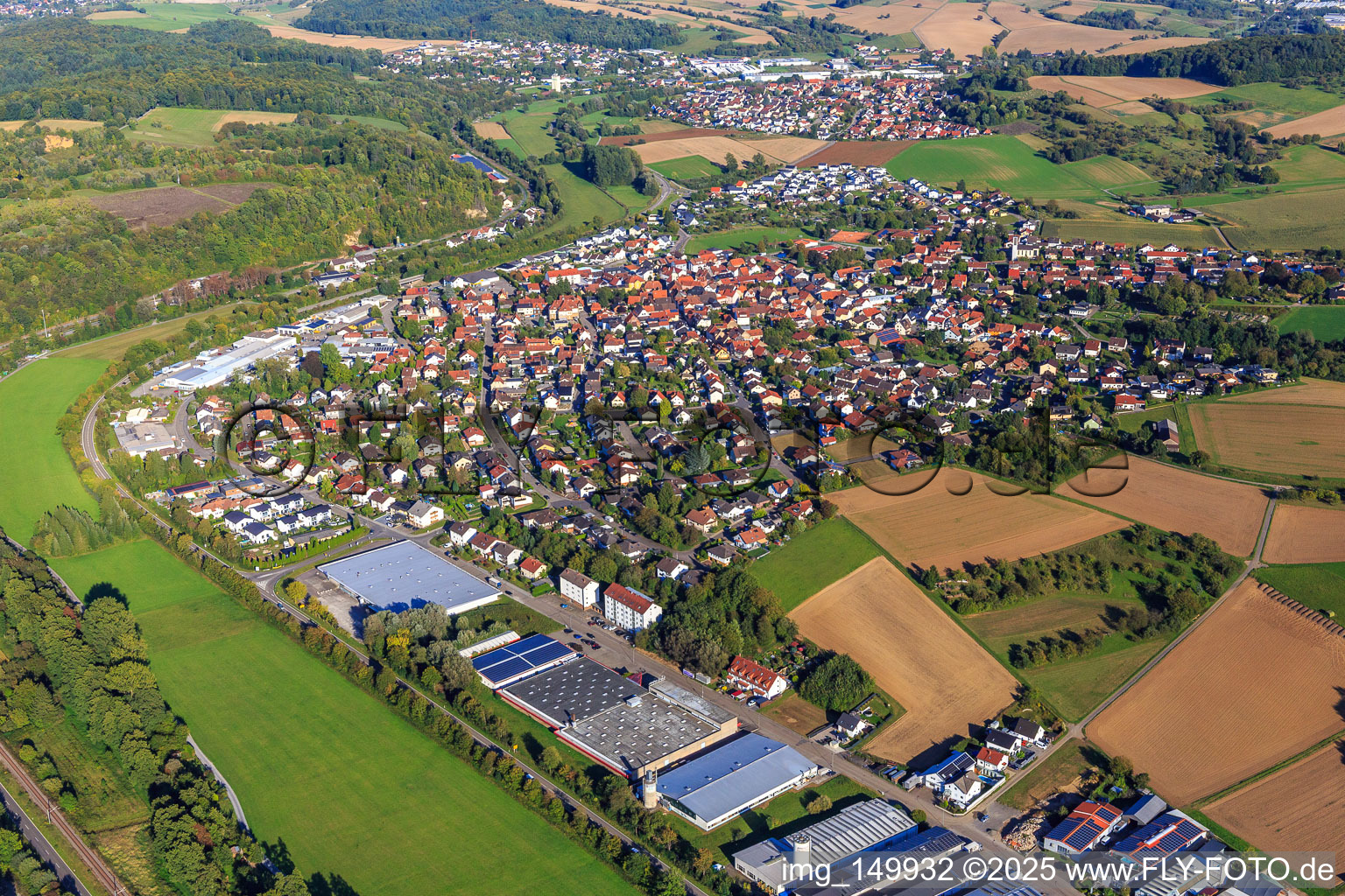View of the town on the Schwarzbach from the southeast and the industrial area with Geiß-Möbel, Rocholl GmbH and Helthosi GmbH in Eschelbronn in the state Baden-Wuerttemberg, Germany