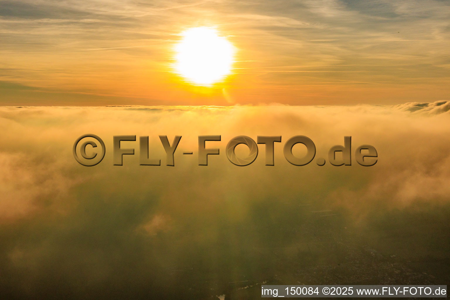 Sunset above the clouds in Steinfeld in the state Rhineland-Palatinate, Germany