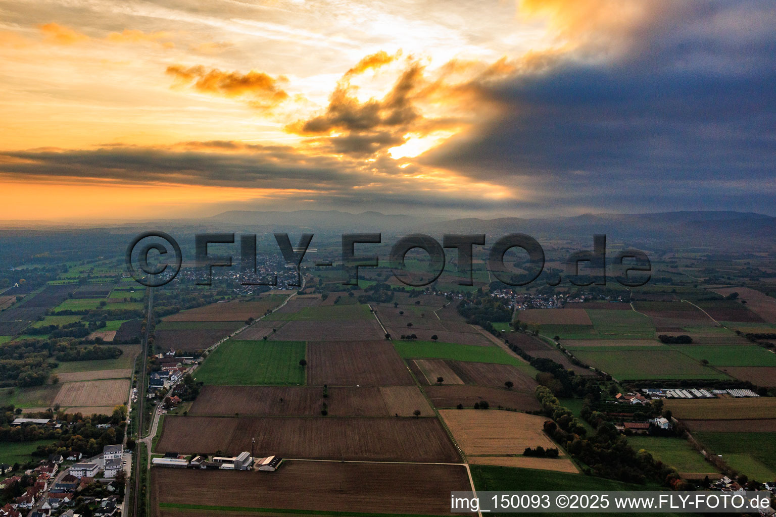 Sunset over the clouds from the east in the evening in Steinfeld in the state Rhineland-Palatinate, Germany