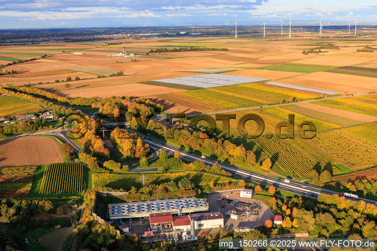 Geothermal power plant Insheim for lithium extraction by Vulcan Energy GmbH in the background Rig V20 of Vercana GmbH and the Offenbach wind farm in Insheim in the state Rhineland-Palatinate, Germany from above