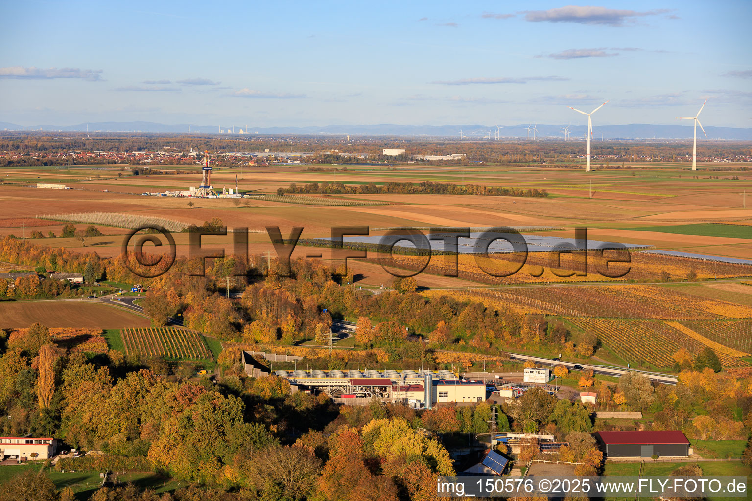 Aerial view of Geothermal power plant Insheim and drilling rig V20 of Vercana GmbH for deep geothermal energy and lithium extraction in front of the Offenbach wind farm, with the GKM Mannheim in the background in Insheim in the state Rhineland-Palatinate, Germany