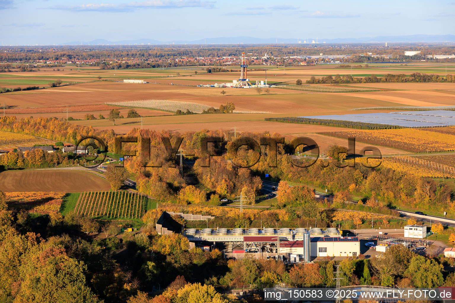 Aerial photograpy of Geothermal power plant Insheim and drilling rig V20 of Vercana GmbH for deep geothermal energy and lithium extraction in front of the Offenbach wind farm, with the GKM Mannheim in the background in Insheim in the state Rhineland-Palatinate, Germany