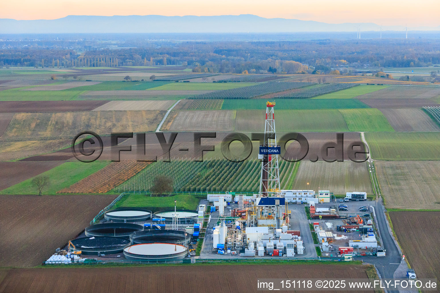Drilling rig of the V20 deep drilling site of Vulcan Energy at Schleidberg for the extraction of geothermal energy and lithium in Insheim in the state Rhineland-Palatinate, Germany seen from a drone