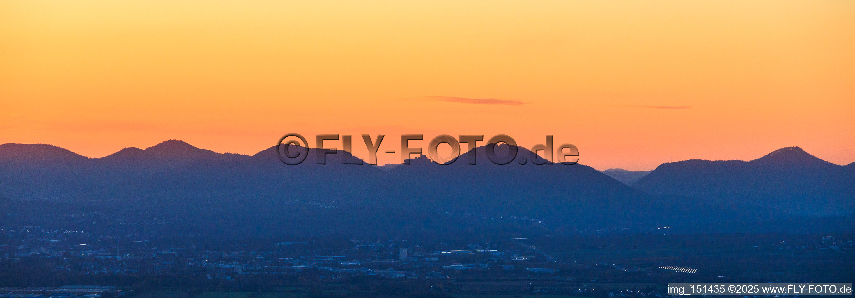 Haardt edge of the Palatinate Forest with the silhouette of Trifels Castle in the evening light in the district Bindersbach in Annweiler am Trifels in the state Rhineland-Palatinate, Germany
