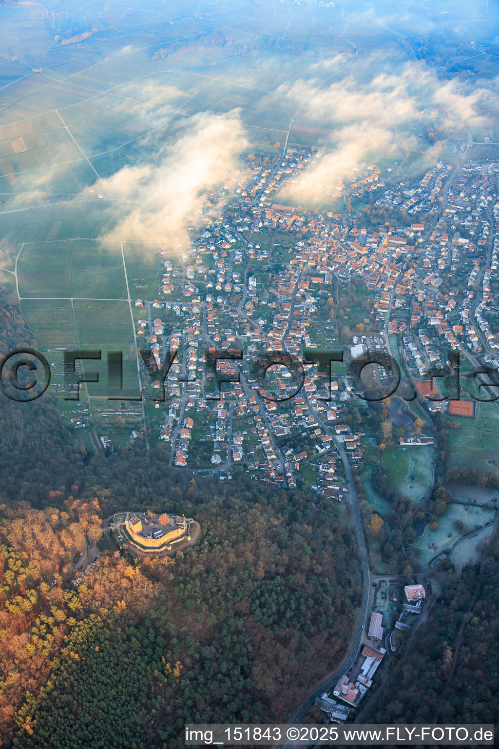 View of the town from the west with Landeck Castle in the evening light in Klingenmünster in the state Rhineland-Palatinate, Germany