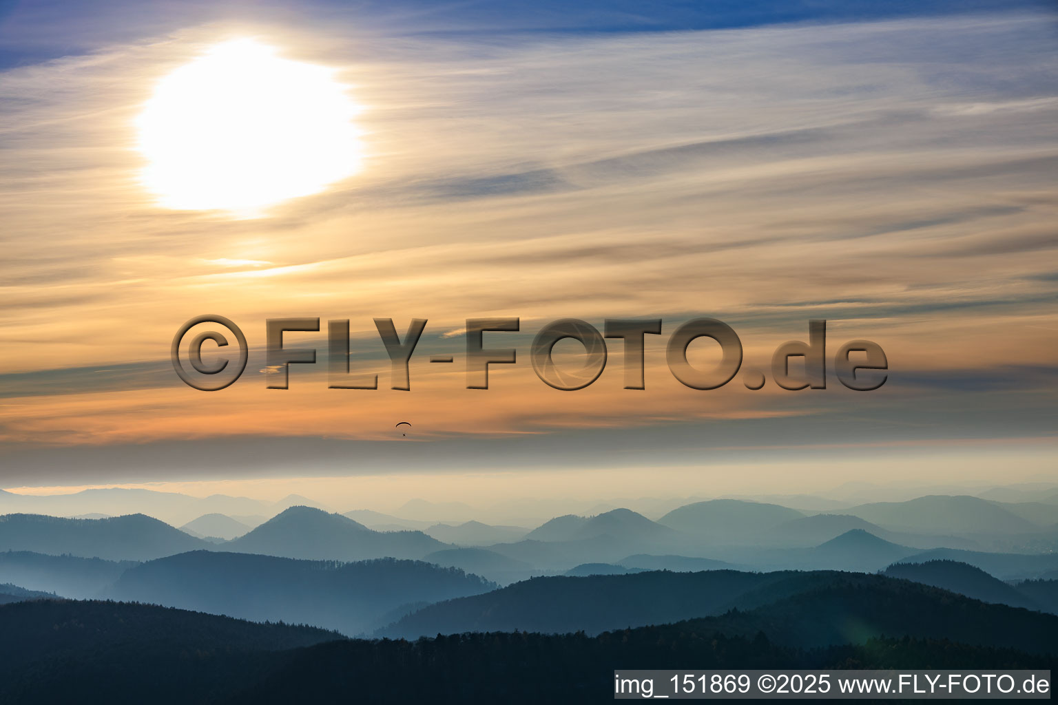 Paragliders over the Wasgau region in the evening in Fischbach bei Dahn in the state Rhineland-Palatinate, Germany