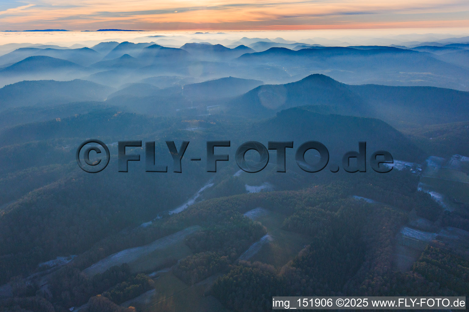 Palatinate Forest and Northern Vosges Mountains in the evening haze in Erlenbach bei Dahn in the state Rhineland-Palatinate, Germany