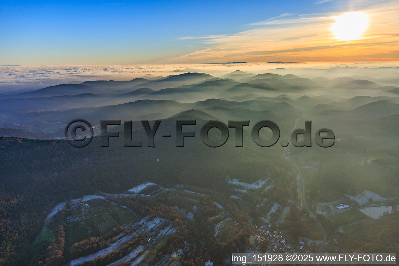 Palatinate Forest and Northern Vosges Mountains in the evening haze in Silz in the state Rhineland-Palatinate, Germany