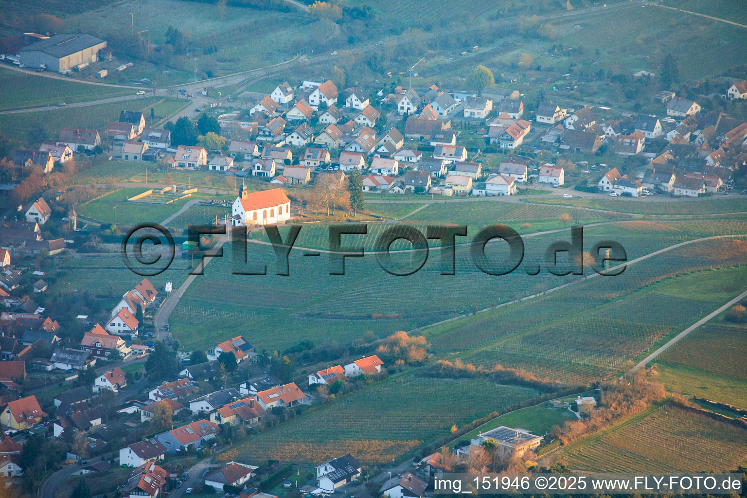 Aerial view of View of the town from the west with the Dionysius Chapel between clouds and mountains in the district Gleiszellen in Gleiszellen-Gleishorbach in the state Rhineland-Palatinate, Germany