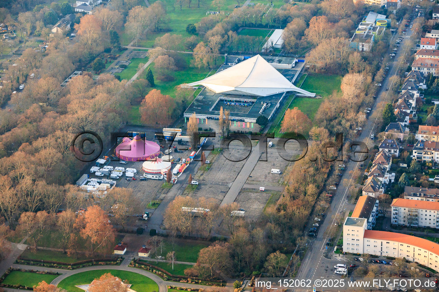 Friedrich-Ebert-Halle and circus in the parking lot at Ebertpark in the district Friesenheim in Ludwigshafen am Rhein in the state Rhineland-Palatinate, Germany