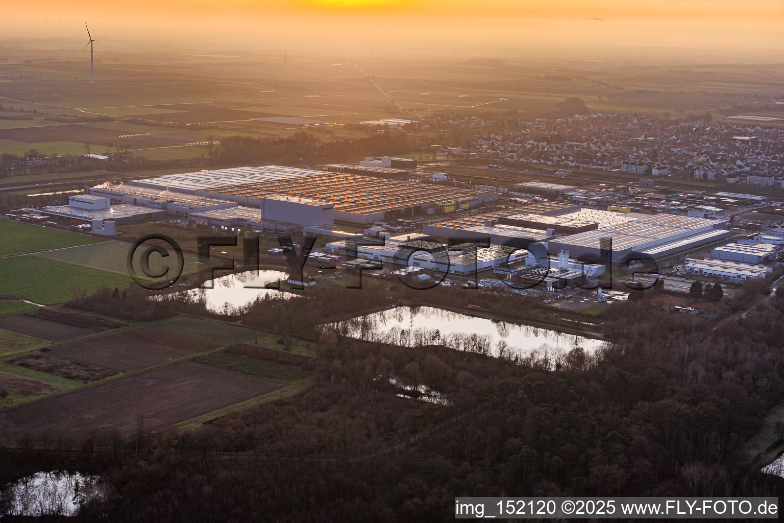Interpark industrial park seen from the northeast on a foggy winter evening in Offenbach an der Queich in the state Rhineland-Palatinate, Germany