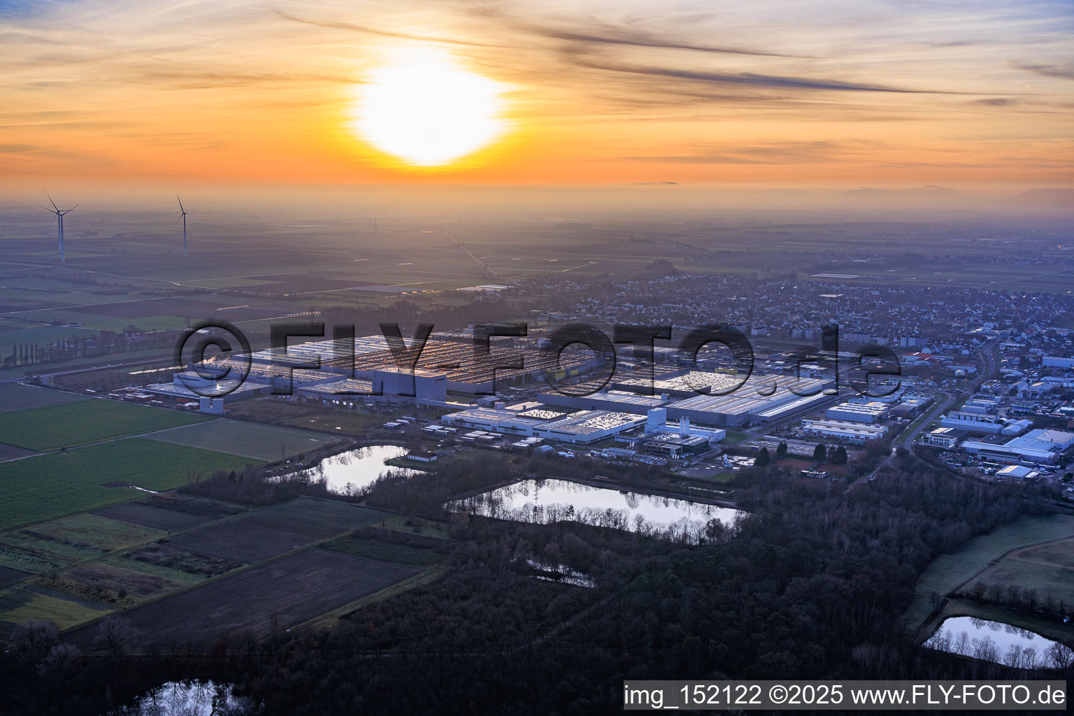 Aerial photograpy of Interpark industrial park seen from the northeast on a foggy winter evening in Offenbach an der Queich in the state Rhineland-Palatinate, Germany