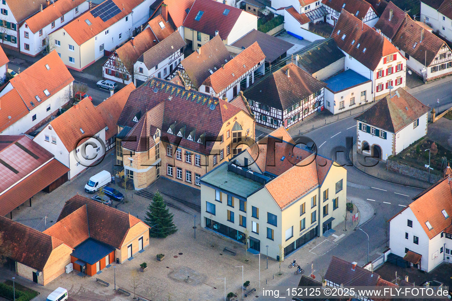 Village square with community center and VR Bank Südpfalz eG branch Ottersheim in Ottersheim bei Landau in the state Rhineland-Palatinate, Germany