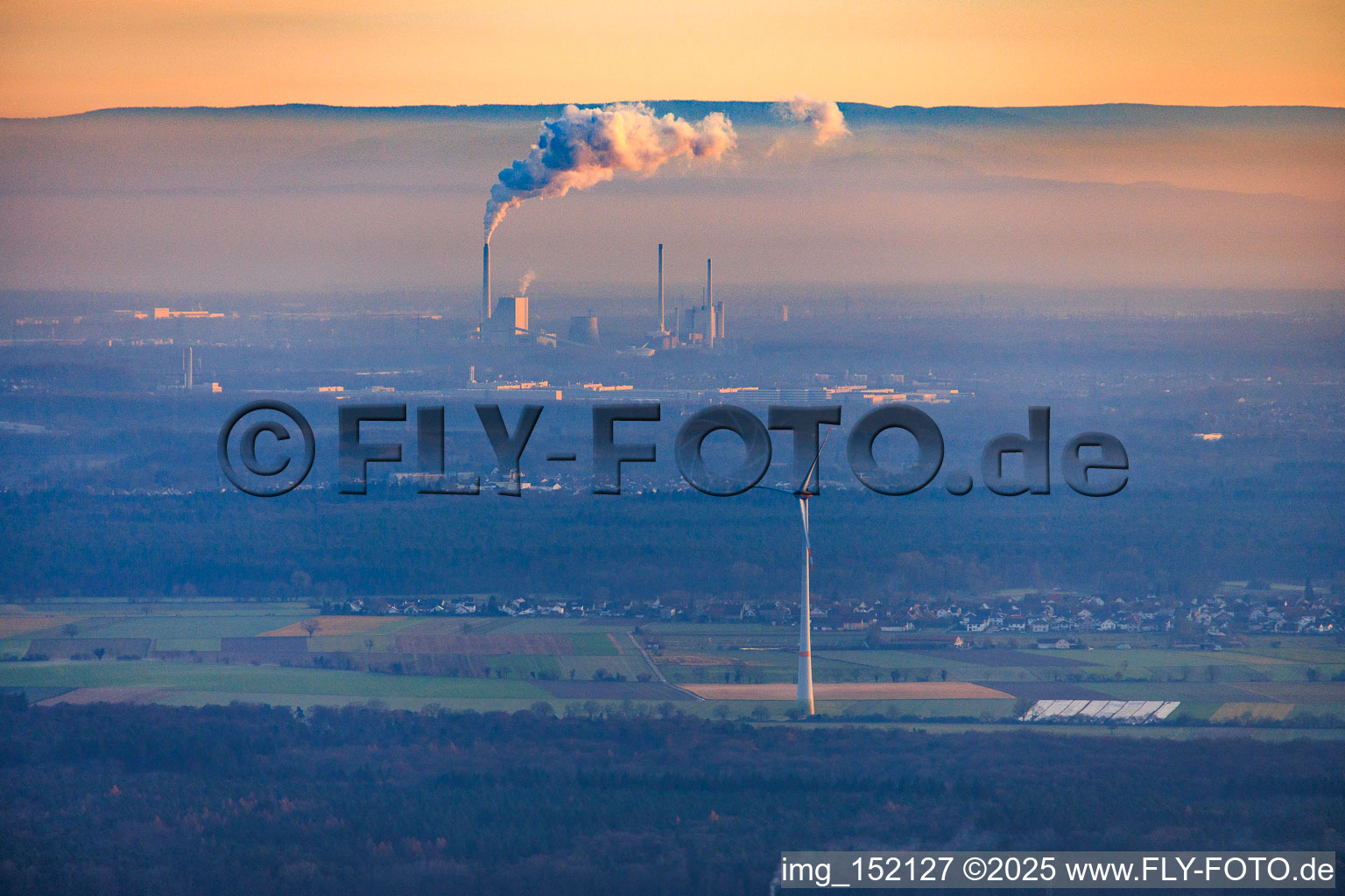Rhine port steam power plant Karlsruhe seen from Offenbach on a foggy winter evening in the district Daxlanden in Karlsruhe in the state Baden-Wuerttemberg, Germany