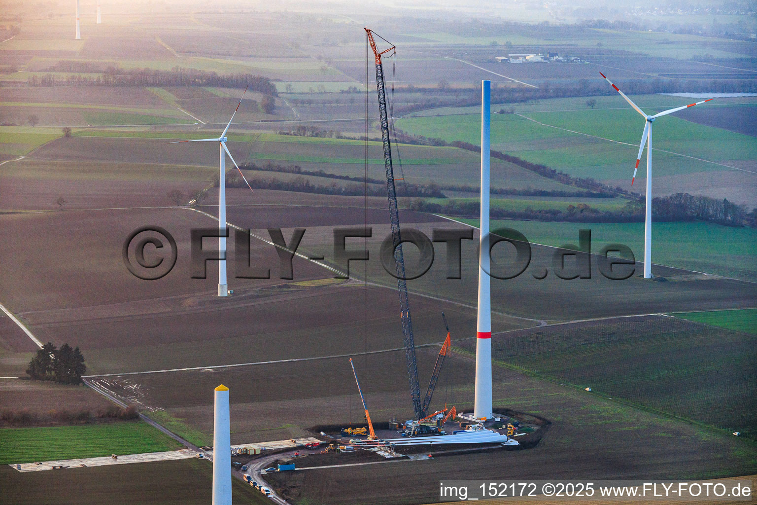 Aerial view of Giant crane for the repowering of the wind farm Minfeld. JUWI is replacing four old turbines (GE 1.5) from 2004 with two new, modern Vestas V162 turbines, each with six MW. in Minfeld in the state Rhineland-Palatinate, Germany