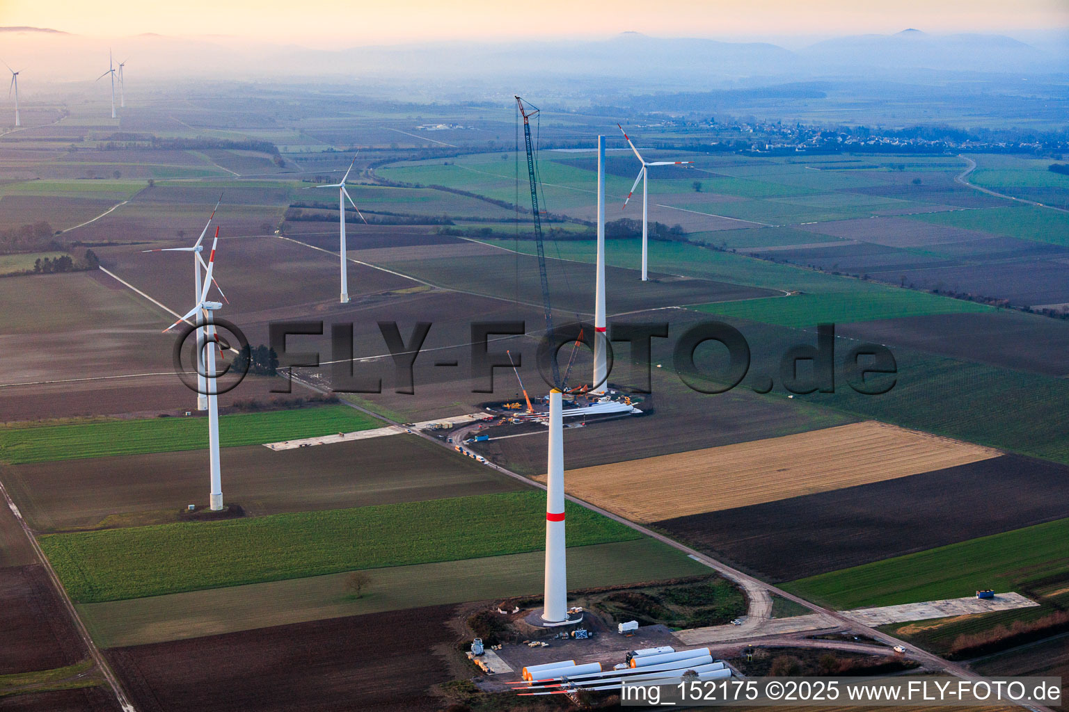 Aerial photograpy of Giant crane for the repowering of the wind farm Minfeld. JUWI is replacing four old turbines (GE 1.5) from 2004 with two new, modern Vestas V162 turbines, each with six MW. in Minfeld in the state Rhineland-Palatinate, Germany