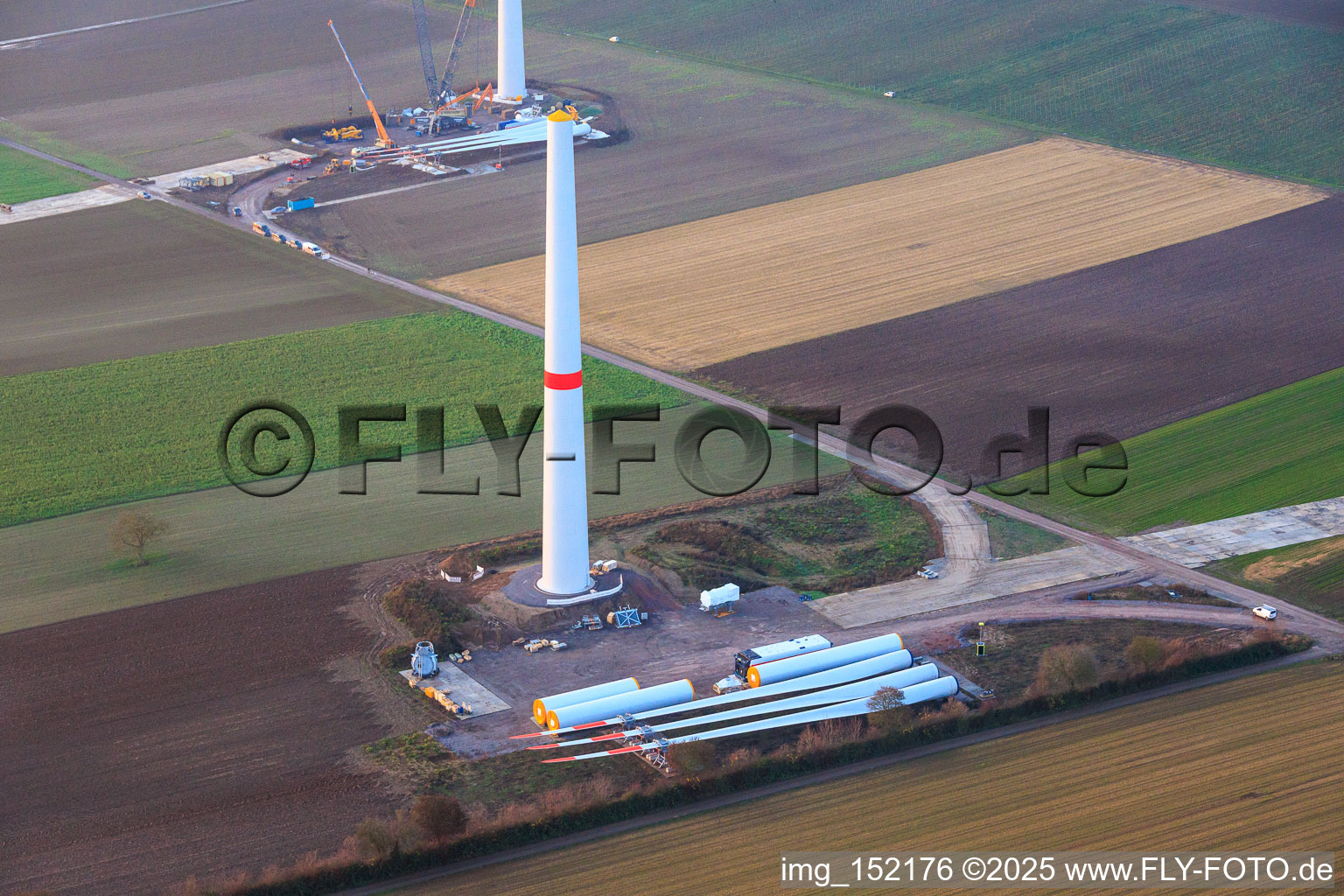 Oblique view of Giant crane for the repowering of the wind farm Minfeld. JUWI is replacing four old turbines (GE 1.5) from 2004 with two new, modern Vestas V162 turbines, each with six MW. in Minfeld in the state Rhineland-Palatinate, Germany