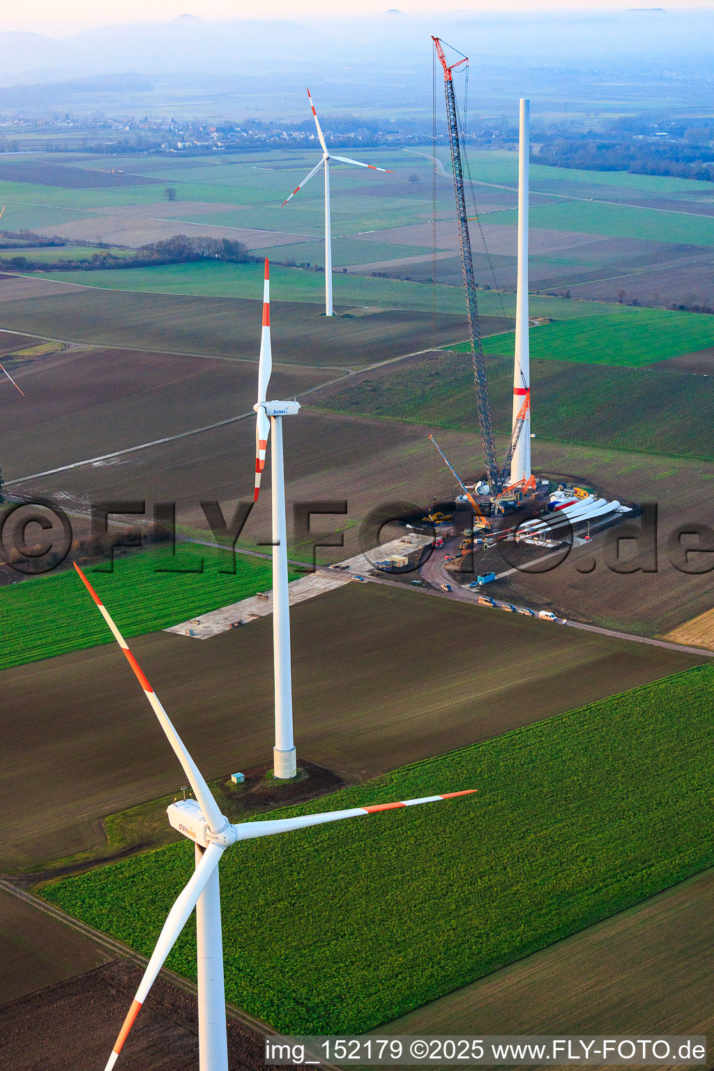 Giant crane for the repowering of the wind farm Minfeld. JUWI is replacing four old turbines (GE 1.5) from 2004 with two new, modern Vestas V162 turbines, each with six MW. in Minfeld in the state Rhineland-Palatinate, Germany out of the air