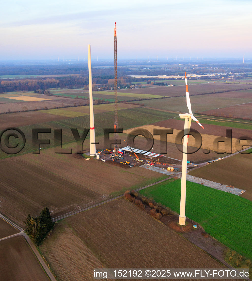 Bird's eye view of Giant crane for the repowering of the wind farm Minfeld. JUWI is replacing four old turbines (GE 1.5) from 2004 with two new, modern Vestas V162 turbines, each with six MW. in Minfeld in the state Rhineland-Palatinate, Germany