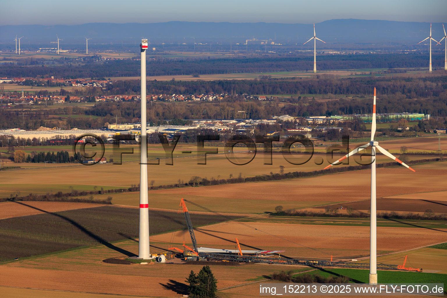 Giant crane for the repowering of the wind farm Minfeld. JUWI is replacing four old turbines (GE 1.5) from 2004 with two new, modern Vestas V162 turbines, each with six MW. in Minfeld in the state Rhineland-Palatinate, Germany viewn from the air