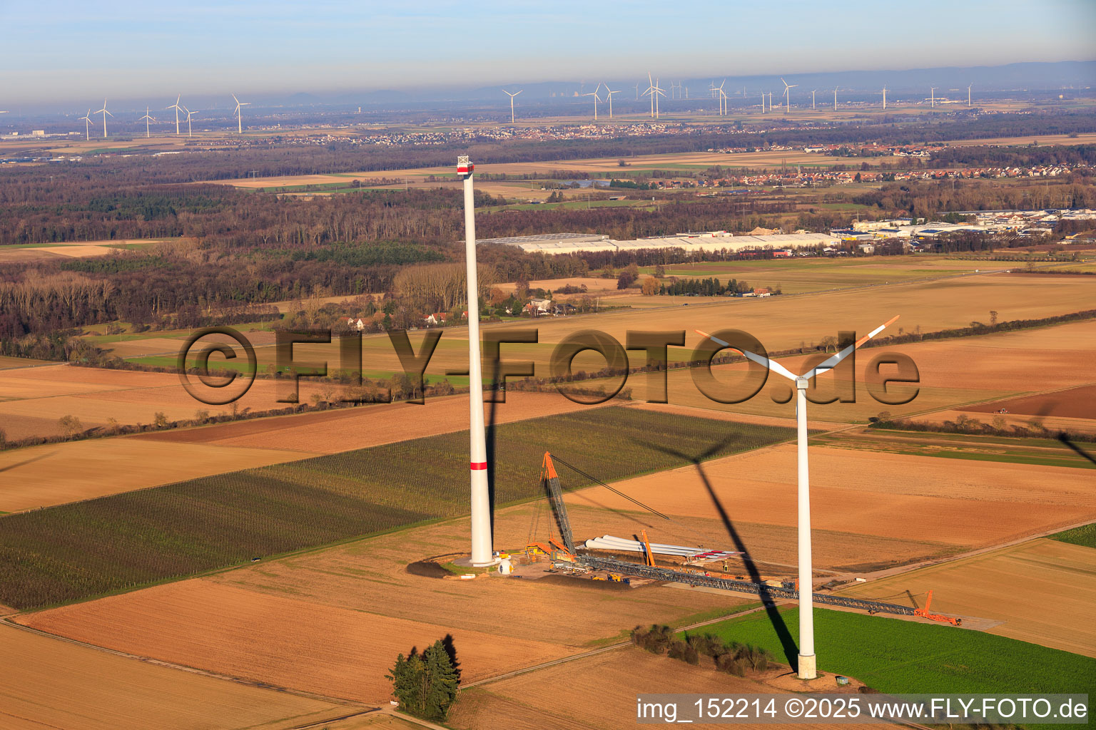 Drone recording of Giant crane for the repowering of the wind farm Minfeld. JUWI is replacing four old turbines (GE 1.5) from 2004 with two new, modern Vestas V162 turbines, each with six MW. in Minfeld in the state Rhineland-Palatinate, Germany
