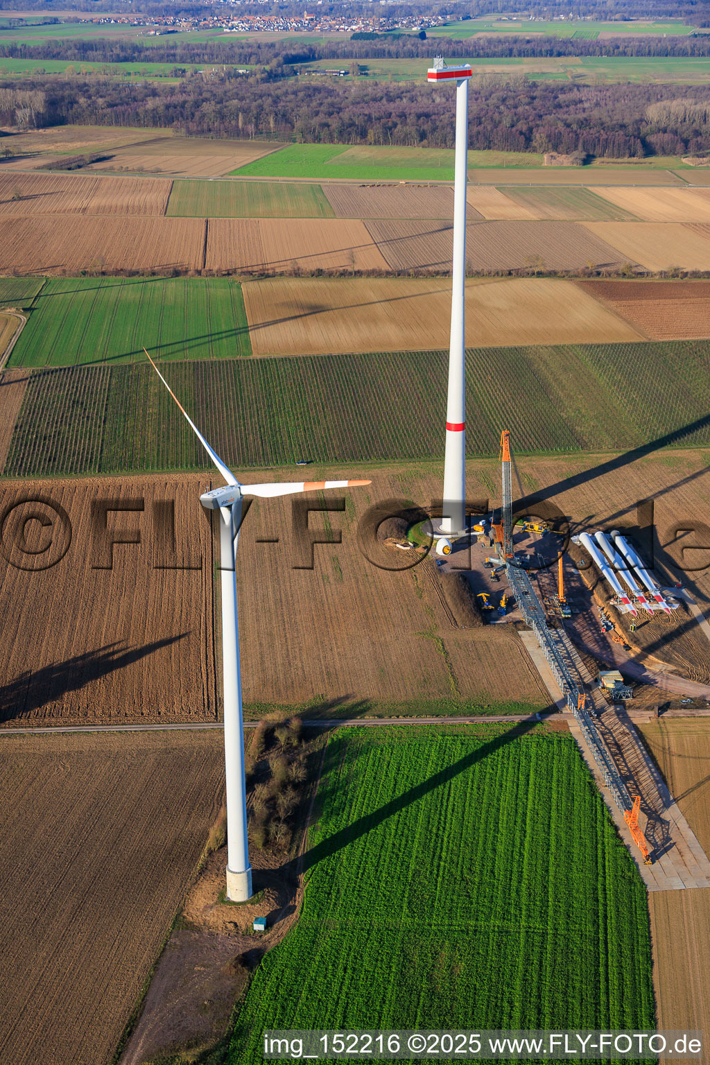 Drone image of Giant crane for the repowering of the wind farm Minfeld. JUWI is replacing four old turbines (GE 1.5) from 2004 with two new, modern Vestas V162 turbines, each with six MW. in Minfeld in the state Rhineland-Palatinate, Germany