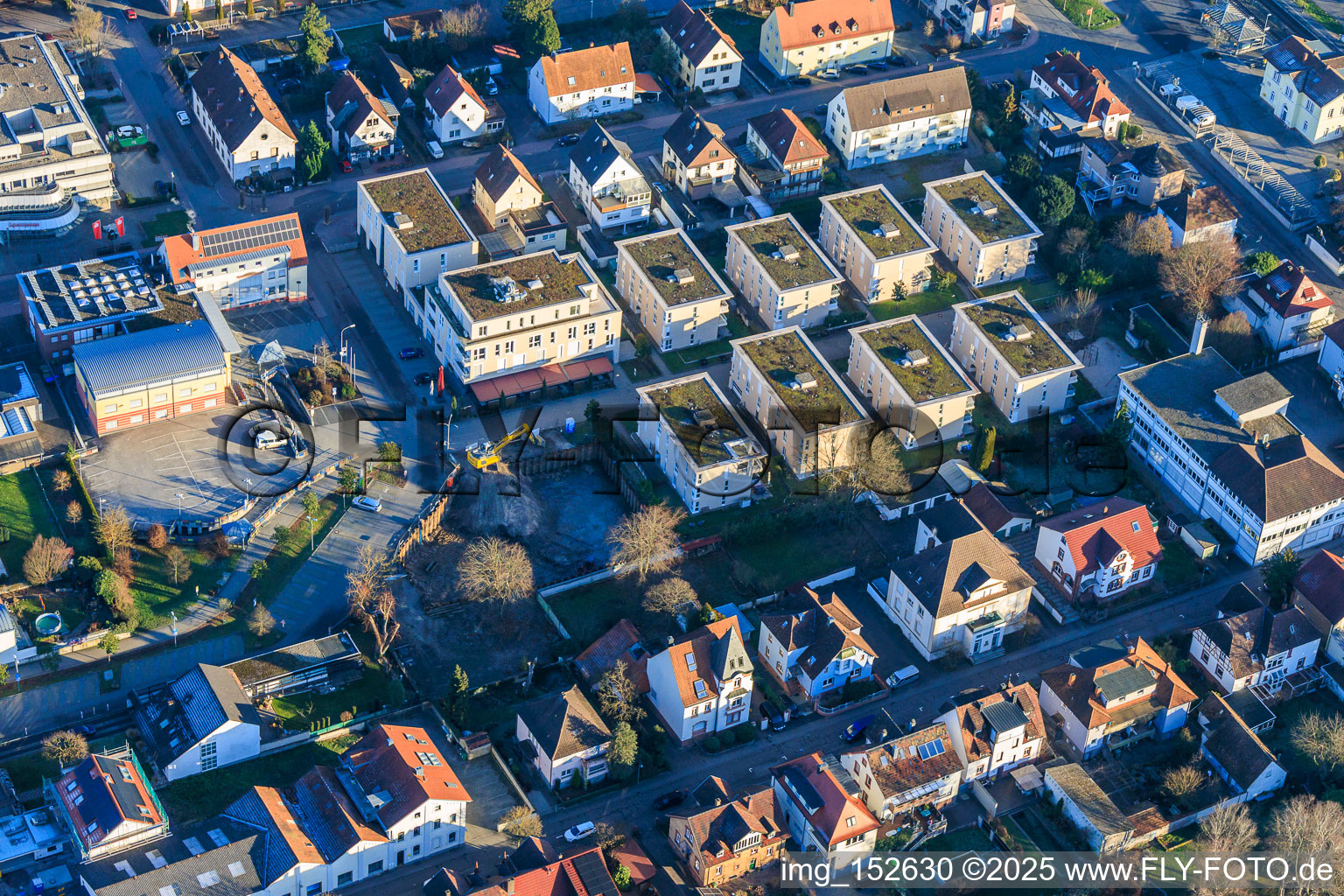 Aerial view of Construction pit for the expansion of the residential complex in the city center in Wörth am Rhein in the state Rhineland-Palatinate, Germany