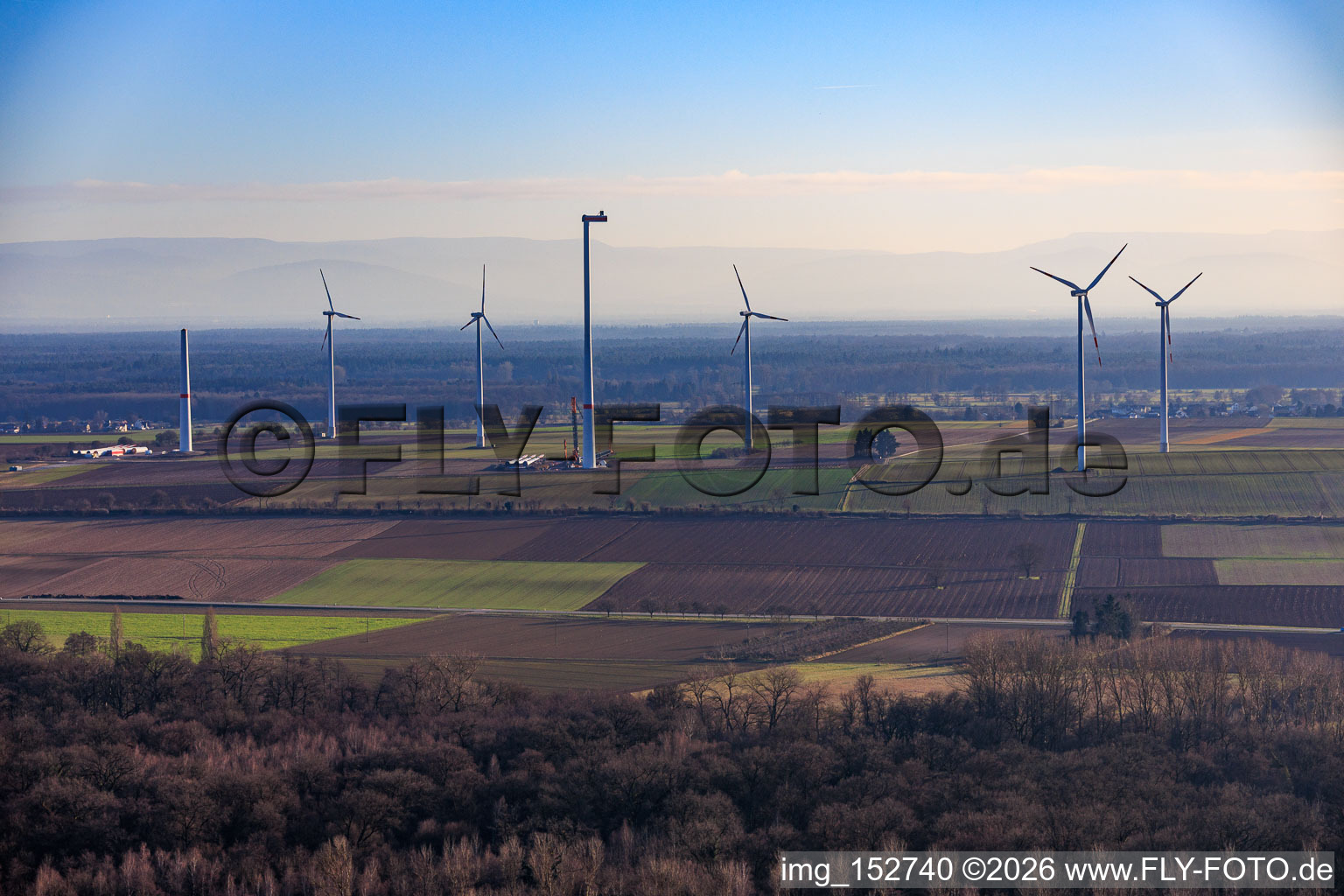 Oblique view of Repowering of the wind farm Minfeld. JUWI is replacing four old turbines (GE 1.5) from 2004 with two new, modern Vestas V162 turbines, each with a capacity of six MW. in Minfeld in the state Rhineland-Palatinate, Germany