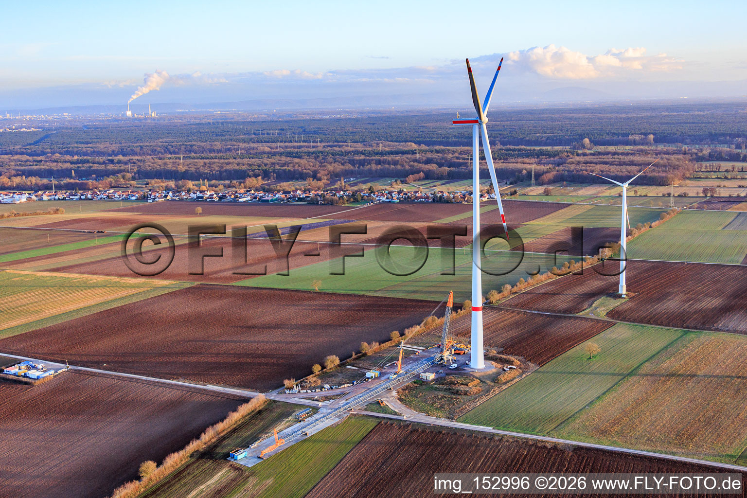 Oblique view of Repowering of the Minfeld wind farm. JUWI is replacing four older turbines (GE 1.5) from 2004 with two new, modern Vestas V162 turbines, each with a capacity of six MW. in Kandel in the state Rhineland-Palatinate, Germany