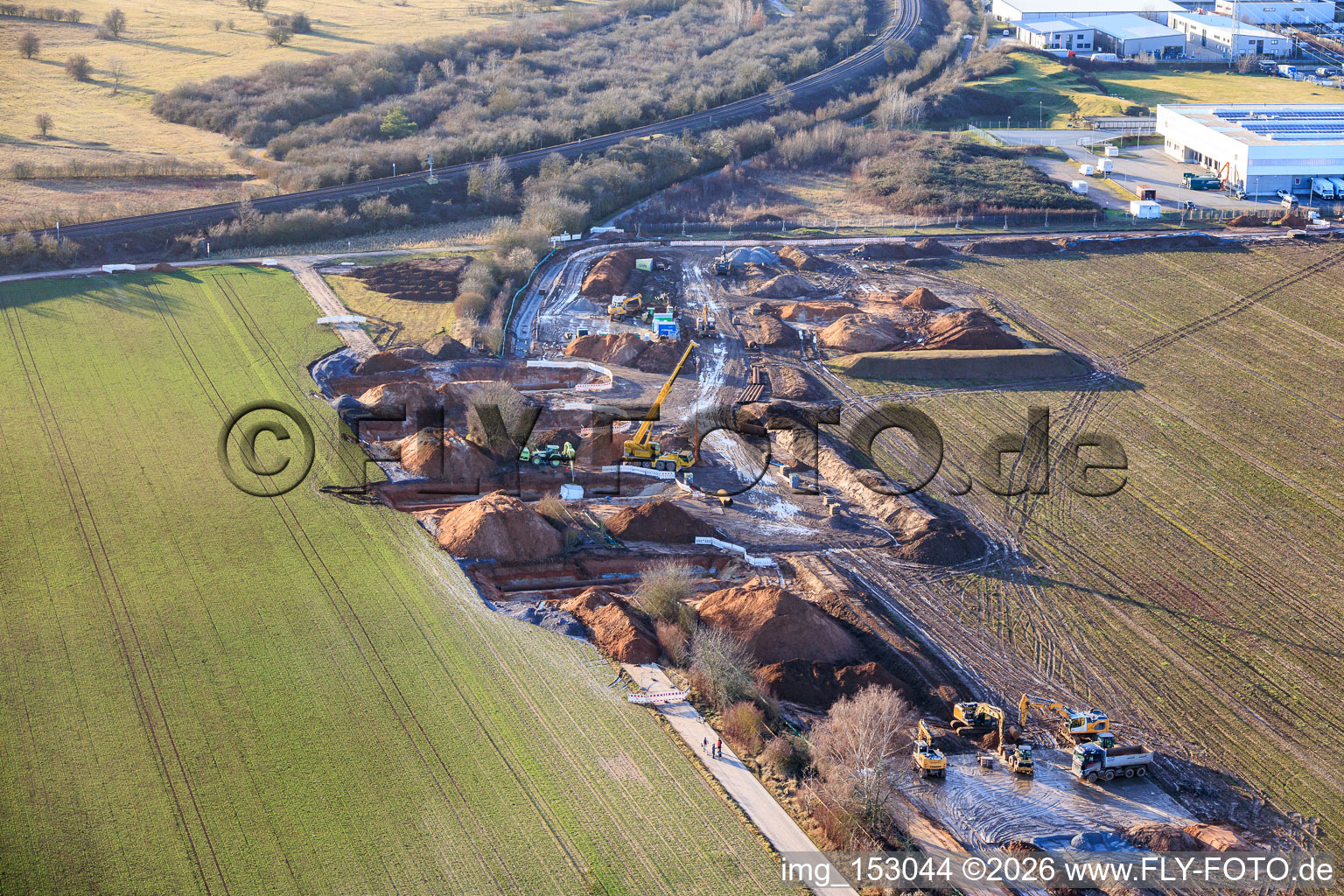 Oblique view of Vulcan Energy construction site for a lithium and geothermal energy extraction plant on the cycle path and former railway line between Herxheim and Landau in Landau in der Pfalz in the state Rhineland-Palatinate, Germany