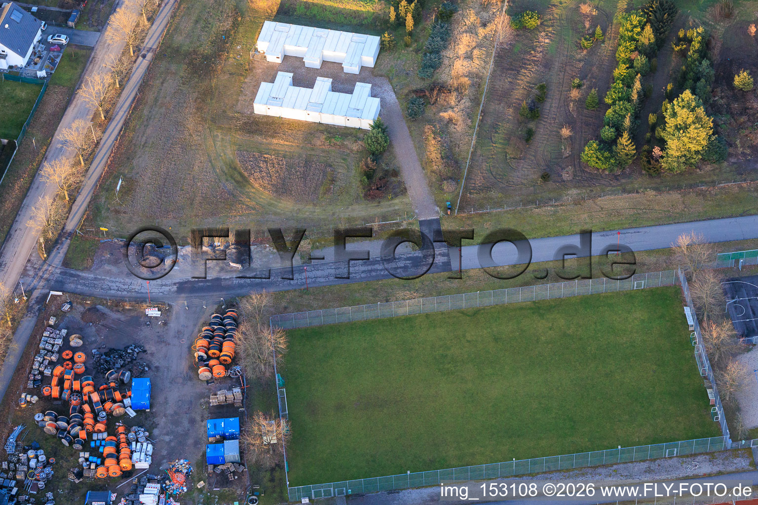 Container storage on Kandeler Straße and small field of TV 1890 Rheinzabern eV in Rheinzabern in the state Rhineland-Palatinate, Germany