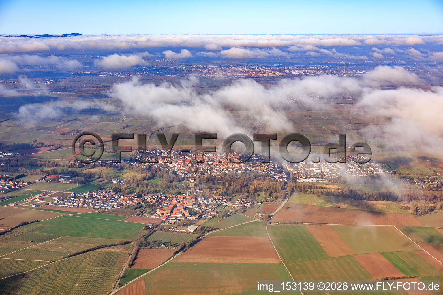 View of the town from the south under clouds in the district Mühlhofen in Billigheim-Ingenheim in the state Rhineland-Palatinate, Germany
