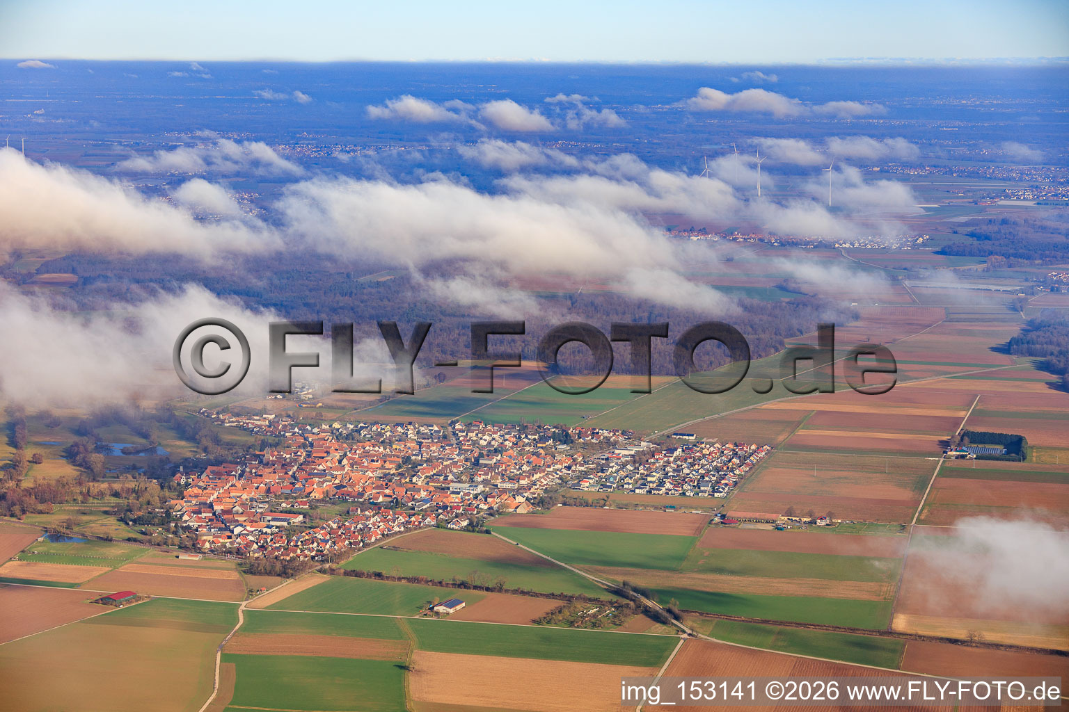 View of the town from the west under clouds in Steinweiler in the state Rhineland-Palatinate, Germany