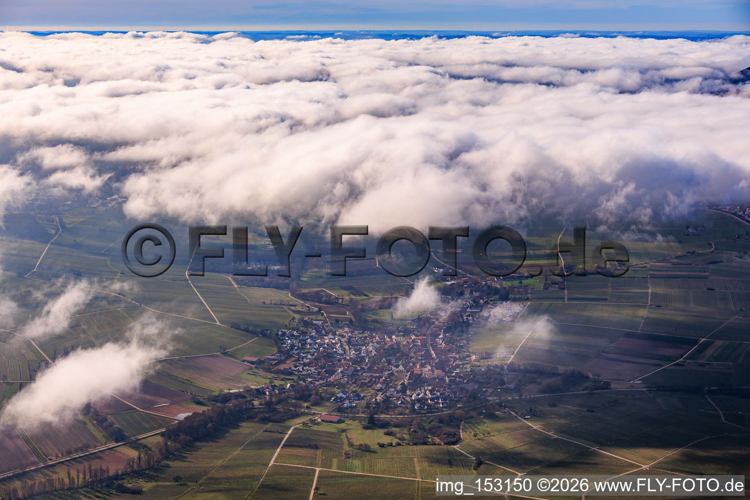 View of the town from the east under clouds in Göcklingen in the state Rhineland-Palatinate, Germany