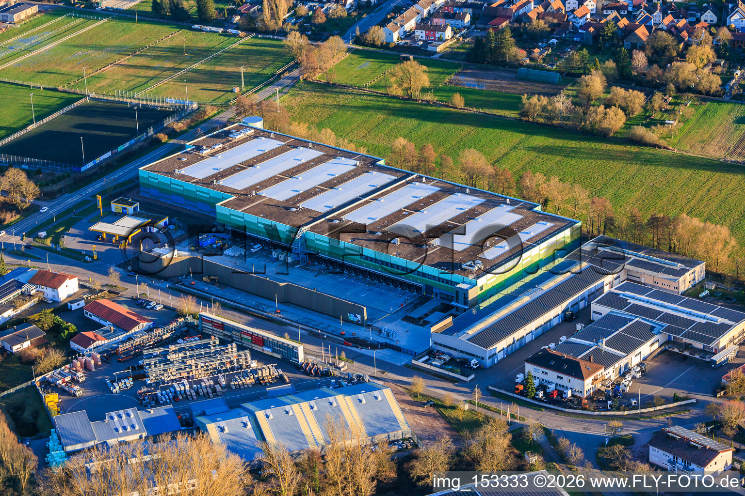 Almost completed new building of the logistics park by HANSAINVEST and DFI-Real-Estate Kandel for FRISCHEPLATTFORM SÜDWEST of Gemüsering Stuttgart GmbH in the district Minderslachen in Kandel in the state Rhineland-Palatinate, Germany viewn from the air