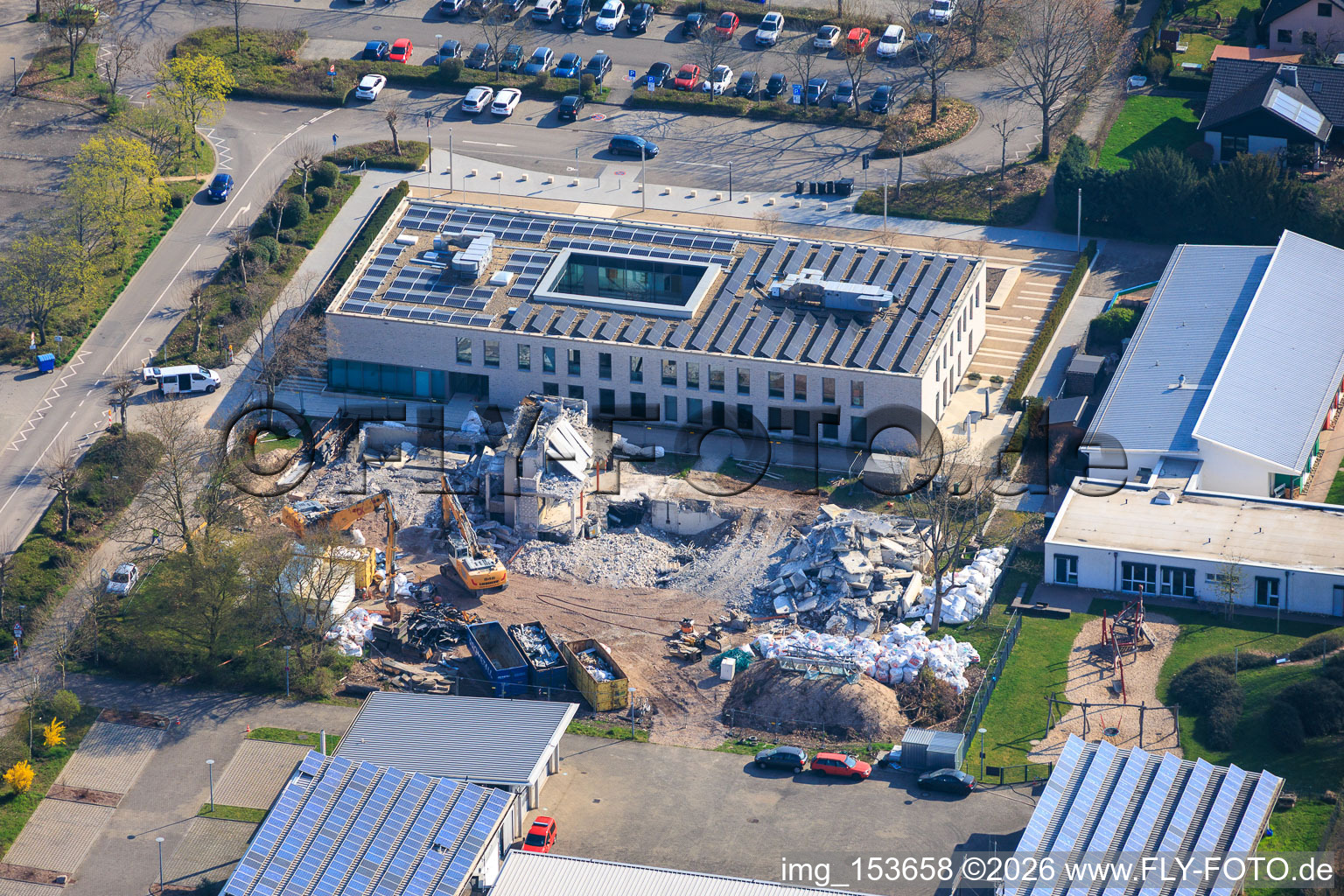 Demolition of the old town hall Offenbach an der Queich between fire station, municipal daycare center Queichhüpfer and new town hall building in Offenbach an der Queich in the state Rhineland-Palatinate, Germany