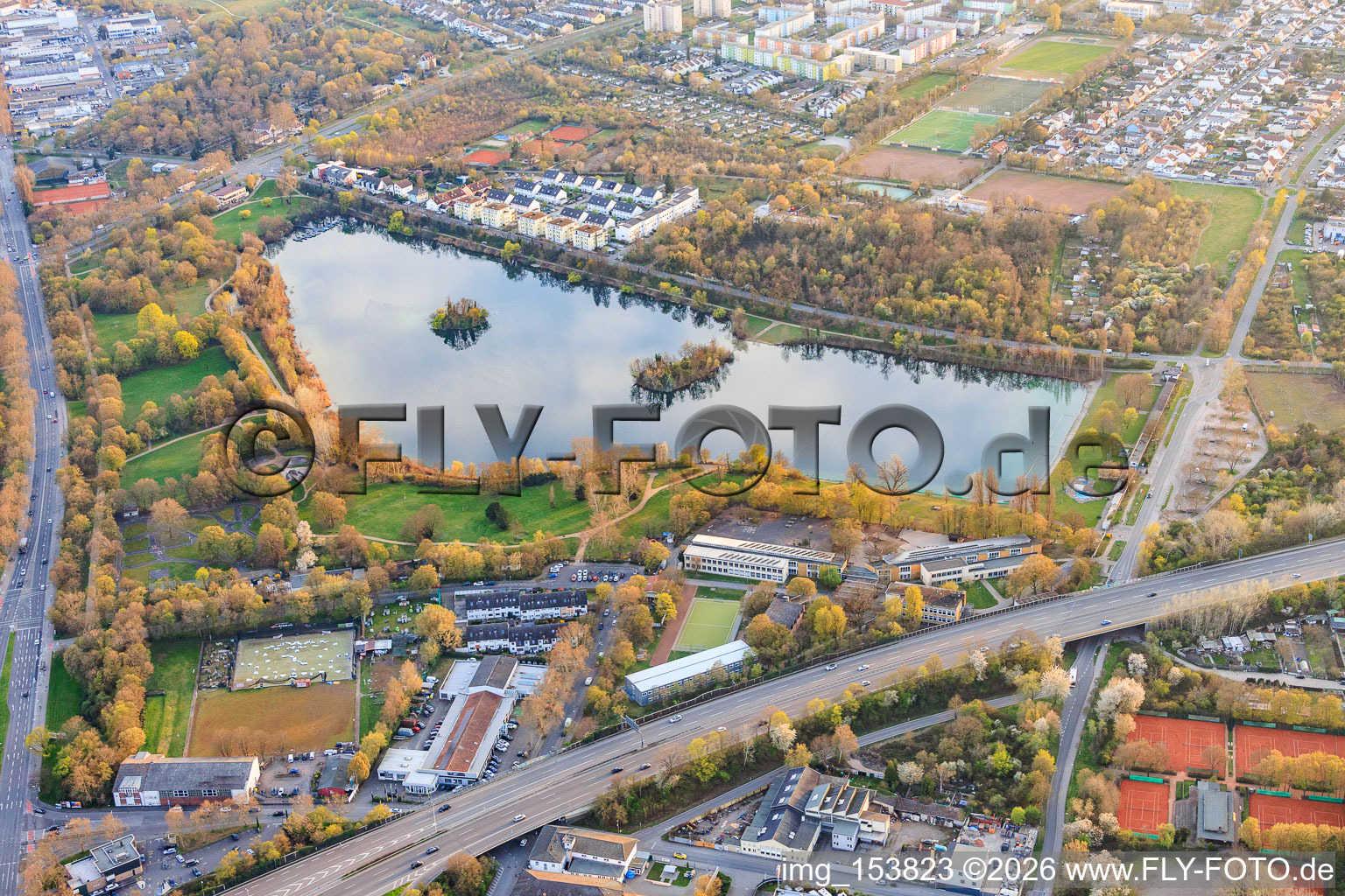 See Große Blies with school on the Blies in the district Mundenheim in Ludwigshafen am Rhein in the state Rhineland-Palatinate, Germany