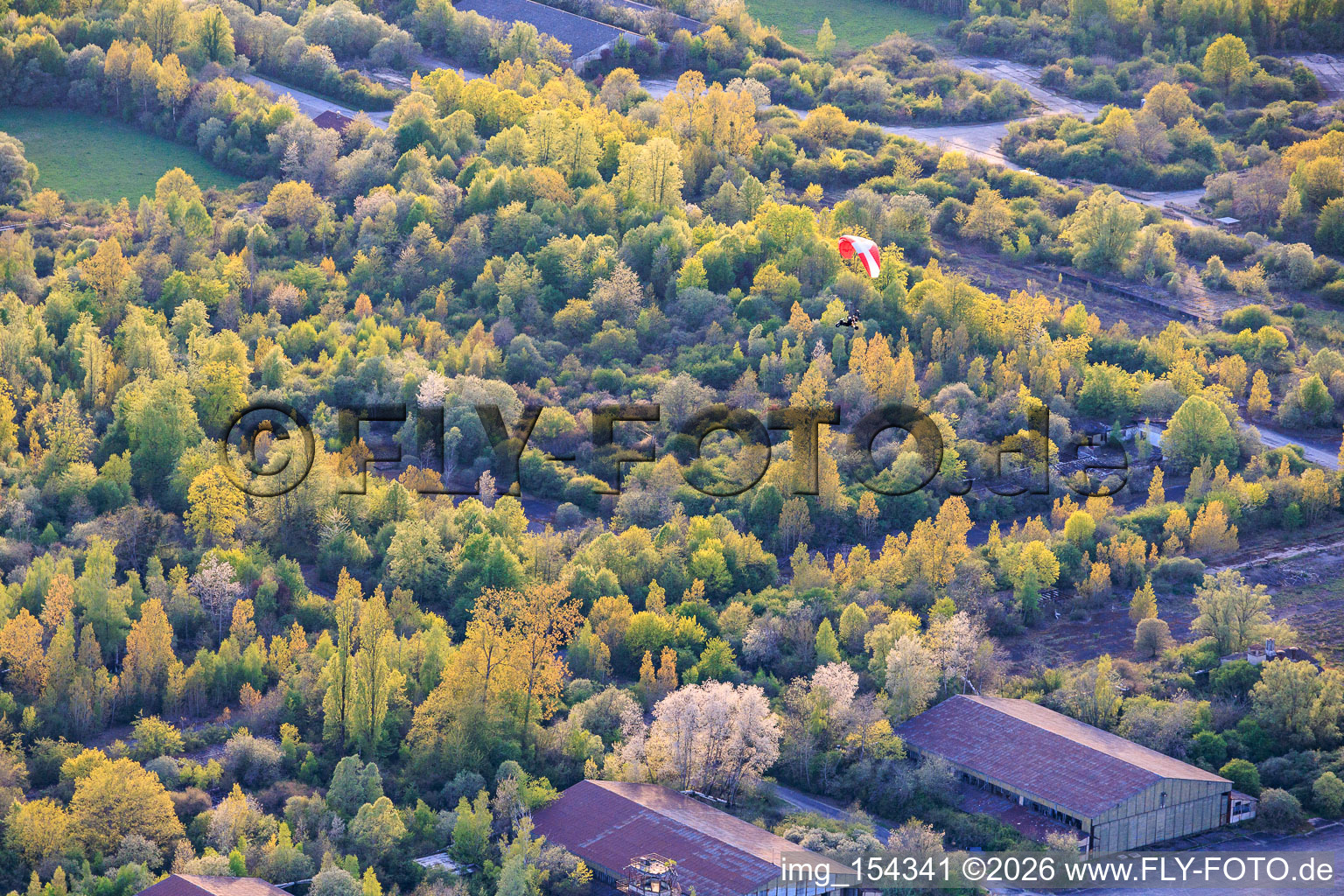 Paragliders over the hangars at the former military airfield Grostenquin in Bistroff in the state Moselle, France