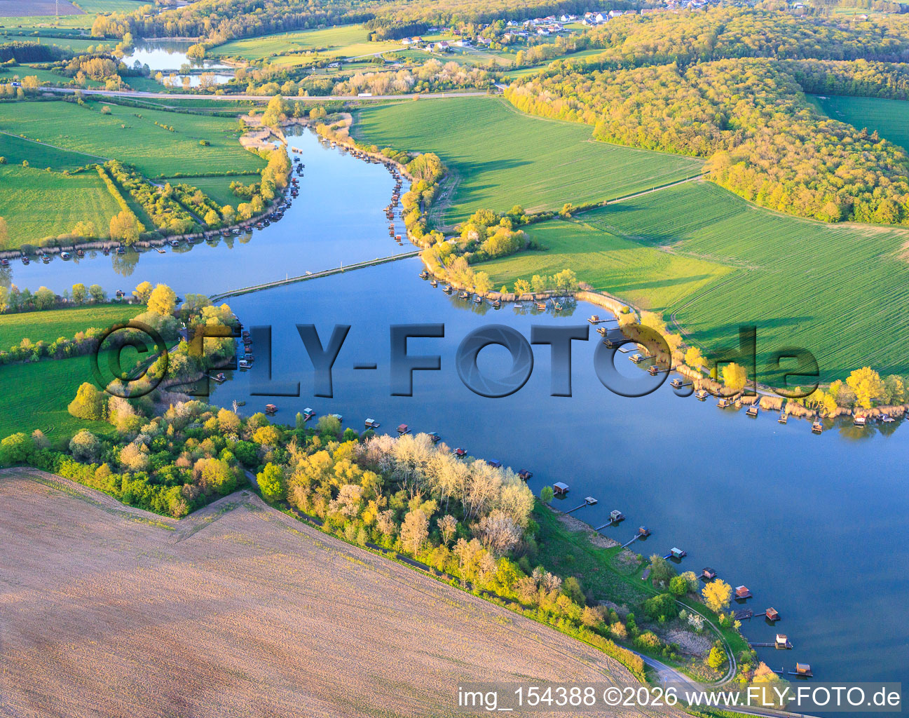 Bridge over the lake Etang du Welschhof in Puttelange-aux-Lacs in the state Moselle, France