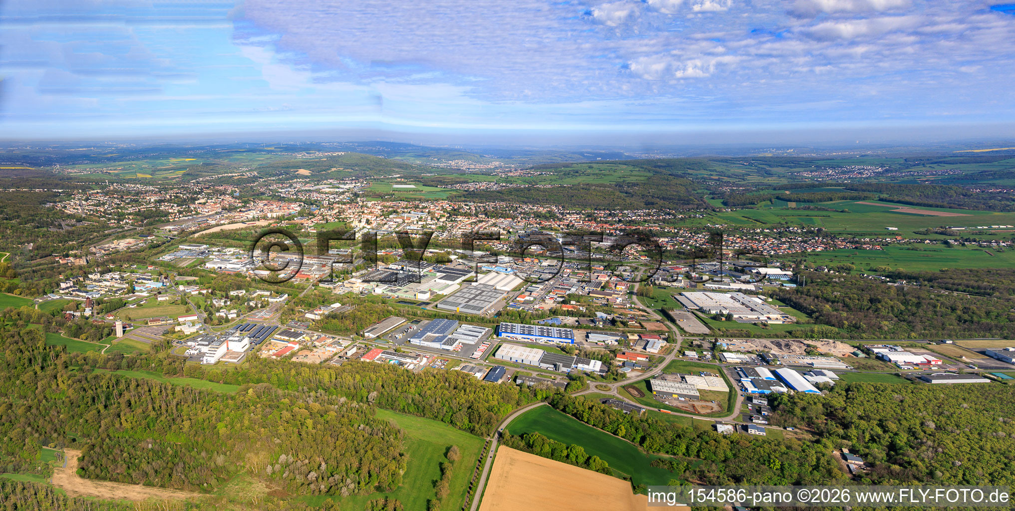 City panorama from the southeast in the district Zone Industrielle du Grand Bois Fayencerie in Saargemünd in the state Moselle, France