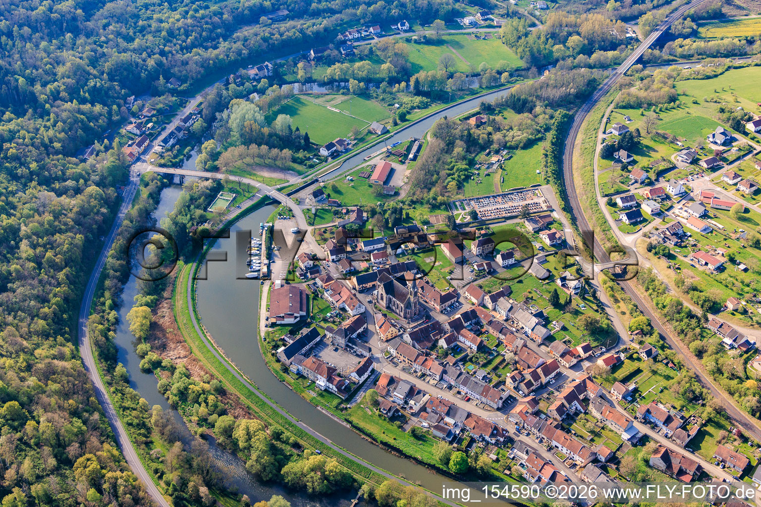 Village view on the other side of the Saar with Spoorboothafen / Port de Plaisance de Wittring on the Saar Canal / Canal des houillères de la Sarre in Wittring in the state Moselle, France