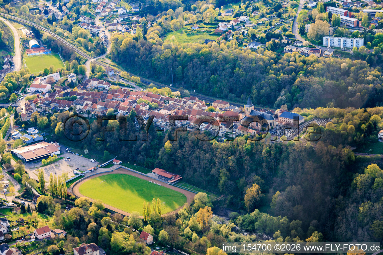 Stade Omnisport sports fields and Espace De Wendel festival hall below the historic old town on the ridge in Hombourg-Haut in the state Moselle, France