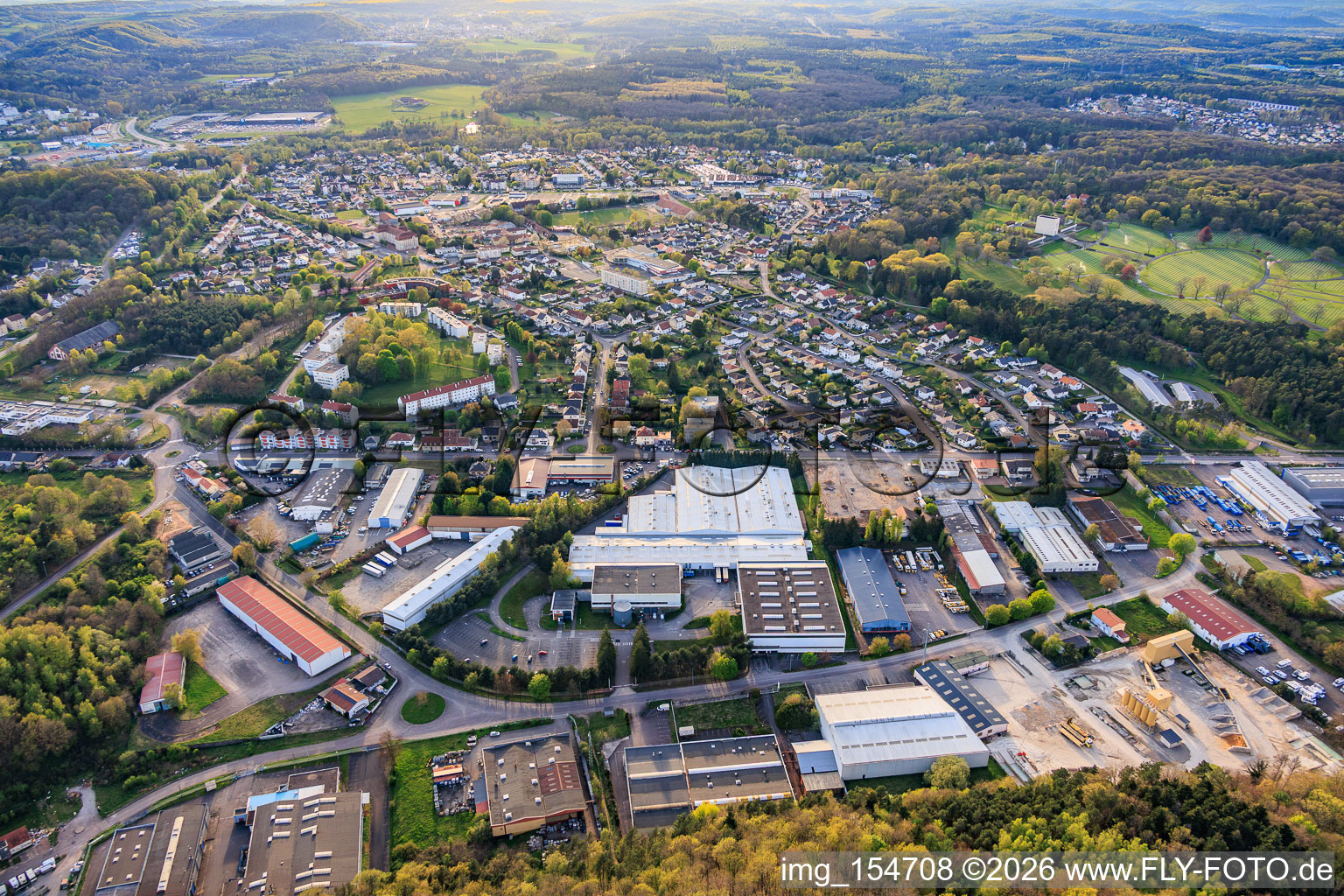 City view from the east with DODO SAMM and ANGERMULLER concrete plant (Béton Prêt à l'Emploi) in the district Zone Industrielle-Hollerloch-Gros Hêtre in Saint-Avold in the state Moselle, France